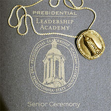 Program and medal from PLA Graduation Ceremony